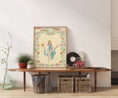 a wooden table topped with baskets next to a painting and record player on top of it