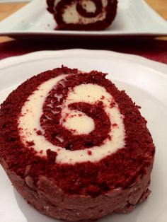 a red velvet cake with white frosting on a plate