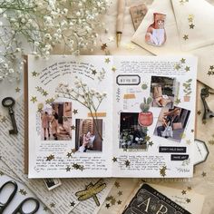 an open scrapbook with photos and flowers on the pages, surrounded by other items