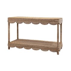 a wicker shelf with scalloped edges on the top and bottom, against a white background