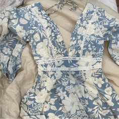 Super Cute Blue & Cream Flower Romper With Tie Back And Sew On Detail! Never Worn, Only Took Off Tag. Size Large. Bohemian Blue Floral Print Sleepwear, Blue Floral Print Backless Mini Dress, Blue Floral Print Sleepwear, Blue Floral Print Short Sleeve Sleepwear, Light Blue Floral Print Knee-length Mini Dress, Flower Romper, Cream Flower, Cream Flowers, Blue Cream