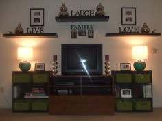 the entertainment center is decorated with pictures and lights