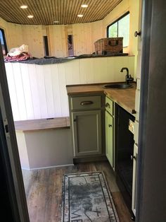 the interior of a tiny home with wood flooring