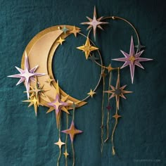 a crescent with stars hanging from it