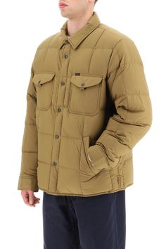 Overshirt-style down jacket by Filson made of a water-resistant nylon fabric with square quilting and slight goose down and feather padding. It features pointed collar, snap button fastening and cuffs, and curved hem with side slits. Handwarmer flannel-lined pockets and chest patch pockets with studded flap. Finished with a mini logo label at chest. Full lining, with two internal pockets. Oversized fit. The model is 187 cm tall and wears a size L. Composition: 100% NY, 100% LO | Filson Men's Lig