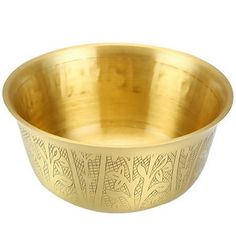 a brass bowl with an intricate design on it