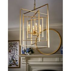 a chandelier hanging over a fireplace in a living room