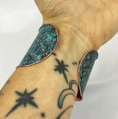 These unique, hand-formed copper and brass cuff bracelets with vibrant patinas create stunning accents to your personal style. Dress up or down- either way you'll be wearing an adornment that will turn heads, start conversations, and delight the eye of the beholder. This is a wide, hammered Copper cuff with a bright blue patina, flanged/textured edges and rounded ends. Please note that patina colors look slightly different depending on the device you view the product on. This is a small cuff- se Hand Forged Bronze Copper Cuff Bracelet, Unique Hand Forged Cuff Bracelet, Bohemian Hand Forged Copper Cuff Bracelet, Artistic Adjustable Patina Cuff Bracelet, Bohemian Brass Bracelet With Patina, Artisan Turquoise Copper Bracelet, Unique Hand Forged Adjustable Bangle, Unique Adjustable Hand Forged Bangle, Artistic Copper Cuff Bracelet Bangle