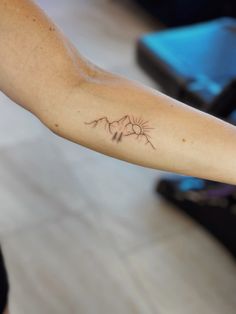 a person with a tattoo on their arm