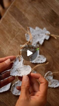 someone is peeling paper from a piece of wood with the words ready to gift and paint on it