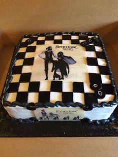 a cake with black and white designs on it