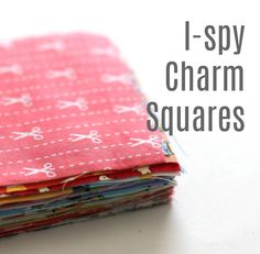 a stack of cloths with scissors on them and the words i - spy charm squares