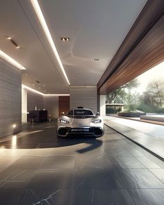 a white sports car parked in a large room next to a wall with lights on it