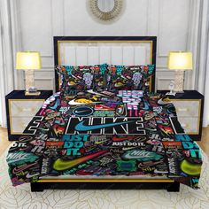 a bed covered in lots of colorful stickers on it's cover and pillow cases