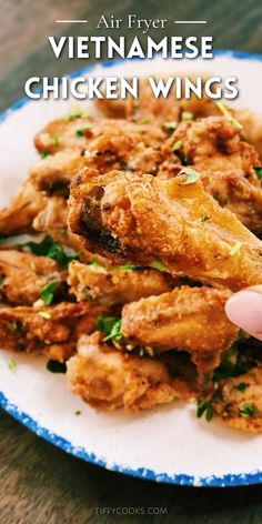 a plate with chicken wings on it and the words, air fryer vietnamese chicken wings