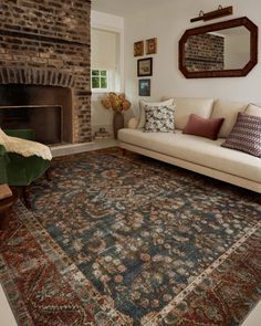 a living room filled with furniture and a fire place