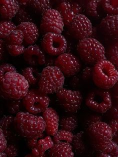 fresh raspberries are shown close up in this image, they look like they have been picked from the tree