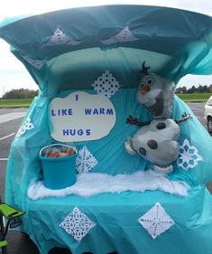 a frozen food cart decorated like a car with the words i like warm hugs written on it