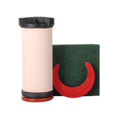 a spool of thread next to a green and red object on a white background