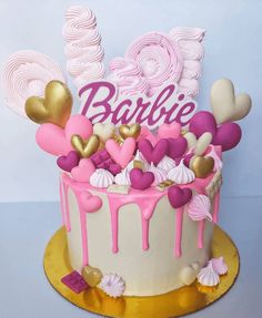 a birthday cake with pink and gold decorations