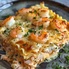 a close up of a plate of food with shrimp and pasta