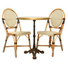 two chairs sitting at a table with one chair facing the other