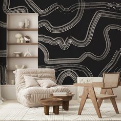 a living room with black and white wallpaper