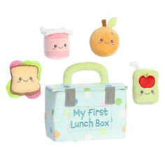 an assortment of stuffed toys including a lunch box