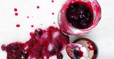 blueberry sauce in a jar and spoon next to it