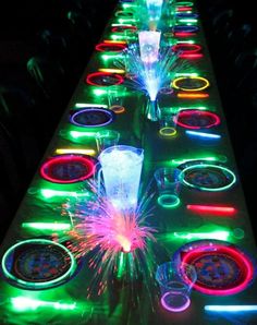 a long table topped with lots of colorful lights