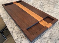 a wooden cutting board sitting on top of a counter