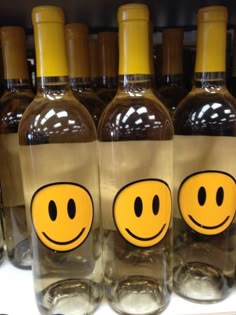 bottles with smiley faces are on display in a store