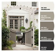 the color scheme for this house is gray, white and grey with an open door