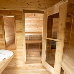 the inside of a sauna with wooden walls