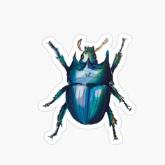 a blue beetle sticker sitting on top of a white surface with its legs spread out