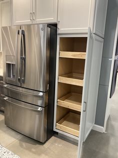 a stainless steel refrigerator and freezer combo in a kitchen