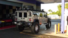 a jeep parked in front of a gas station