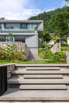 the stairs lead up to the house and into the yard, which is surrounded by stone walls