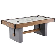 the air hockey table is made from steel and wood, with an ice rink on top