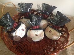 a basket filled with ceramic ornaments on top of a table