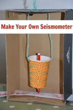 an open box with a string attached to it and the words make your own seismometer