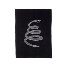 a black towel with a silver snake on it