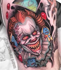 a close up of a person's arm with tattoos on it and clown face