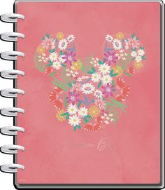 a pink notebook with flowers in the shape of mickey mouse's head