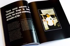 an open book with a photo of a man in white shirt and black pants on it