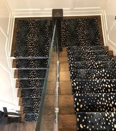 the stairs are decorated with black and gold polka dots