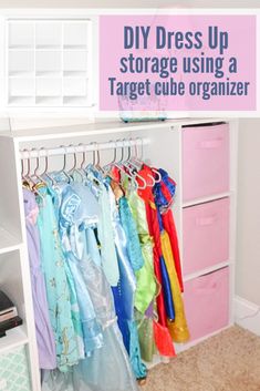 an organized closet with clothes hanging on hangers and the words diy dress up storage using a target cube organizer