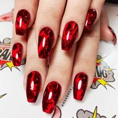 Carrie, is that you?! If you’re dressing up as the blood-drenched teen queen, match your costume to your nails with this ruby red set. To create this look, use a foil base with red glass gel for a slick and sinister finish.

Design by @asabree Diy Halloween Nail Art, Red Halloween, Emerald Nails, Halloween Manicure, Tattoo Henna, Cute Halloween Nails, Nail Effects, Galaxy Nails, Mermaid Nails