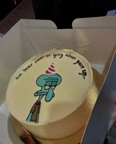 there is a cake in the box with writing on it