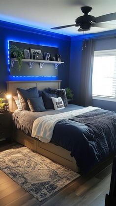 a bed room with a neatly made bed next to a window and a ceiling fan